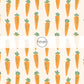 Scattered Orange Carrots on Cream Fabric by the Yard.