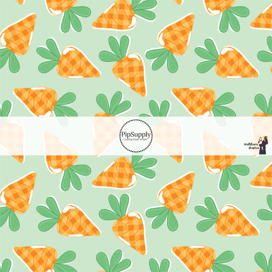 Scattered Orange Cartoon Carrots on Mint Green Fabric by the Yard.