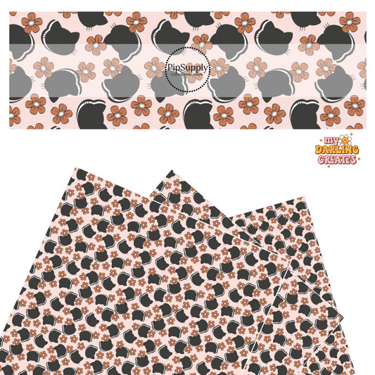 Rust flowers with black cats on pink faux leather sheets