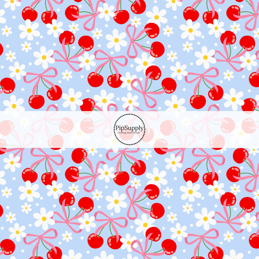 This fruit fabric by the yard features red cherries, bows, and daisies on blue. This fun pattern fabric can be used for all your sewing and crafting needs!