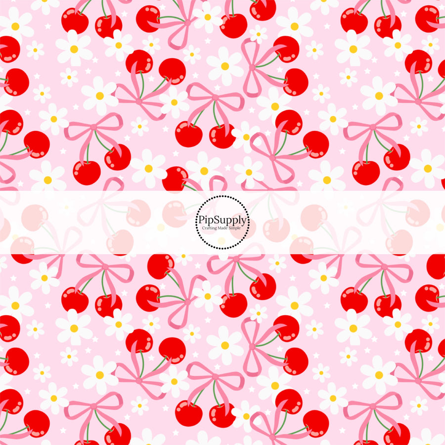 This fruit fabric by the yard features red cherries, bows, and daisies on pink. This fun pattern fabric can be used for all your sewing and crafting needs!