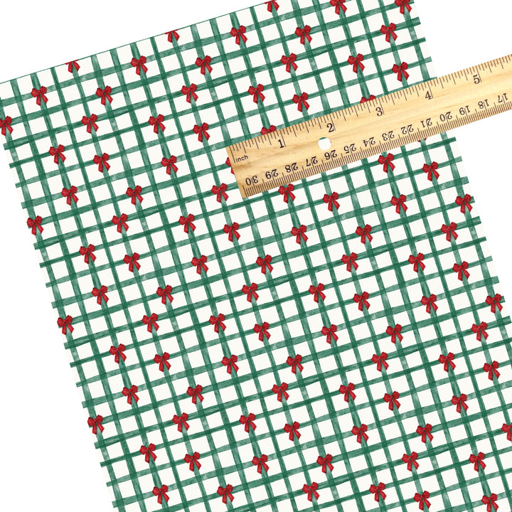 These Christmas themed pattern faux leather sheets contain the following design elements: Christmas green gingham pattern with red bows. Our CPSIA compliant faux leather sheets or rolls can be used for all types of crafting projects.