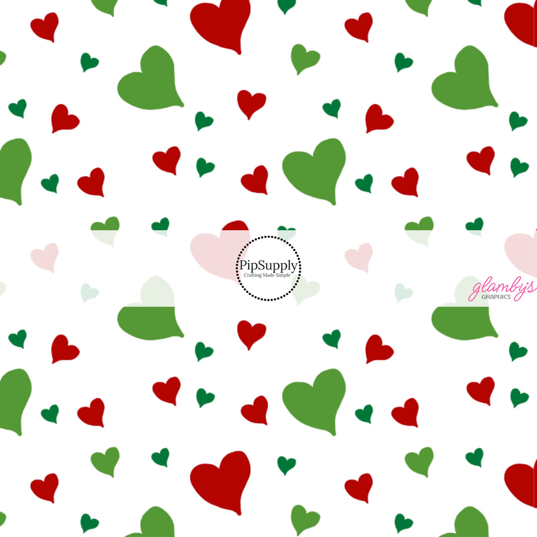 These Christmas themed pattern fabric by the yard features the following design elements: red and green hearts on cream. This fun themed fabric can be used for all your sewing and crafting needs!