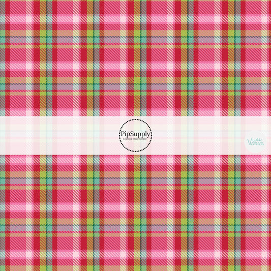 These winter themed pattern fabric by the yard features the following design elements: colorful Christmas tartan pattern. This fun themed fabric can be used for all your sewing and crafting needs!