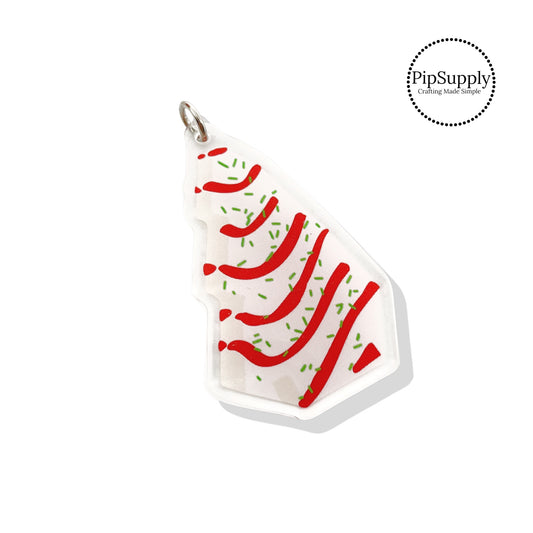 Red icing with green sprinkles on white christmas tree cake acrylic pendant
