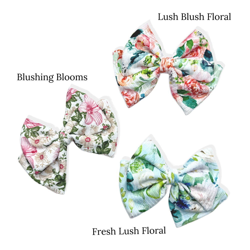 These spring floral DIY bows can be quickly cut and assembled for a trendy spring bow. They're ideal for easy at-home styling, individual use, or even resale. Get creative and add a splash of color to your look with these low-maintenance bows.