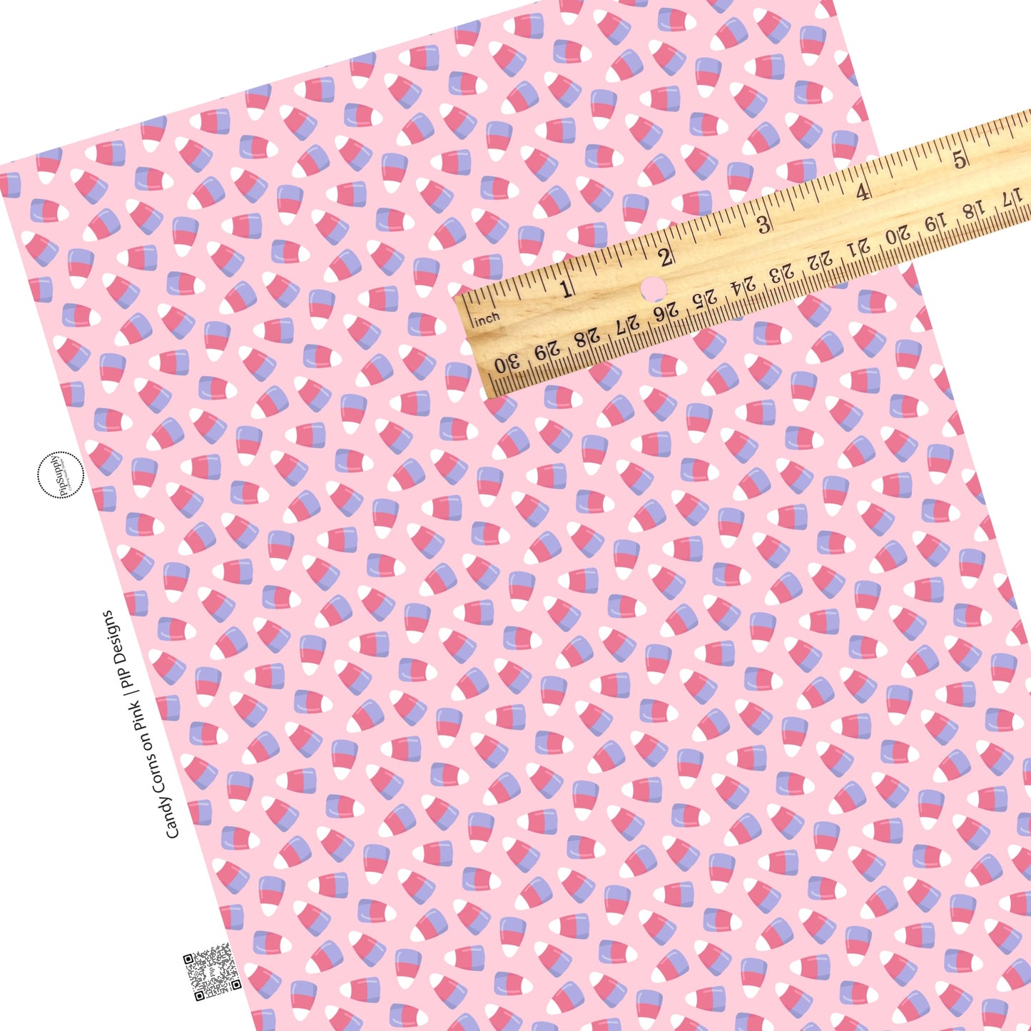 Scattered candy corn multi on pink faux leather sheets