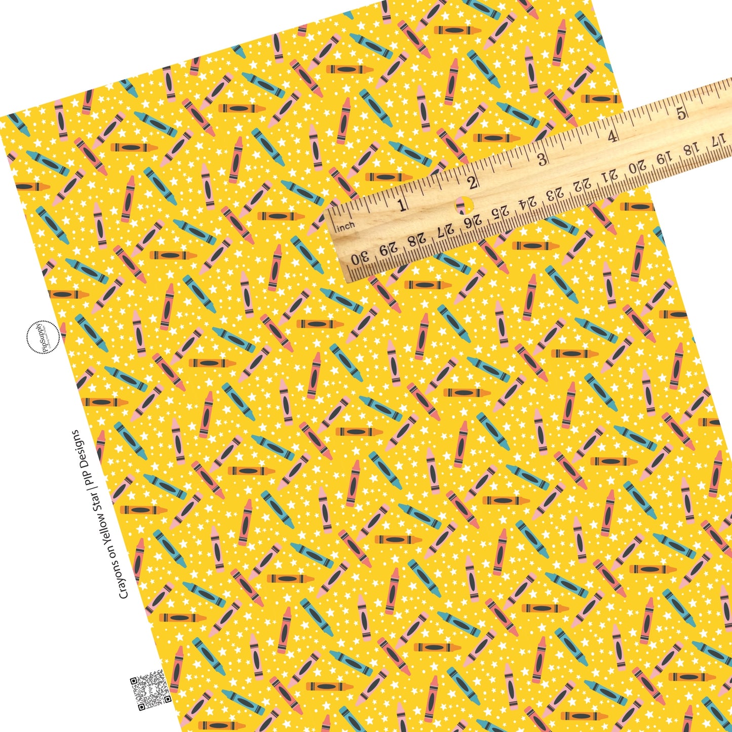 Colorful crayons with white stars on yellow faux leather sheets