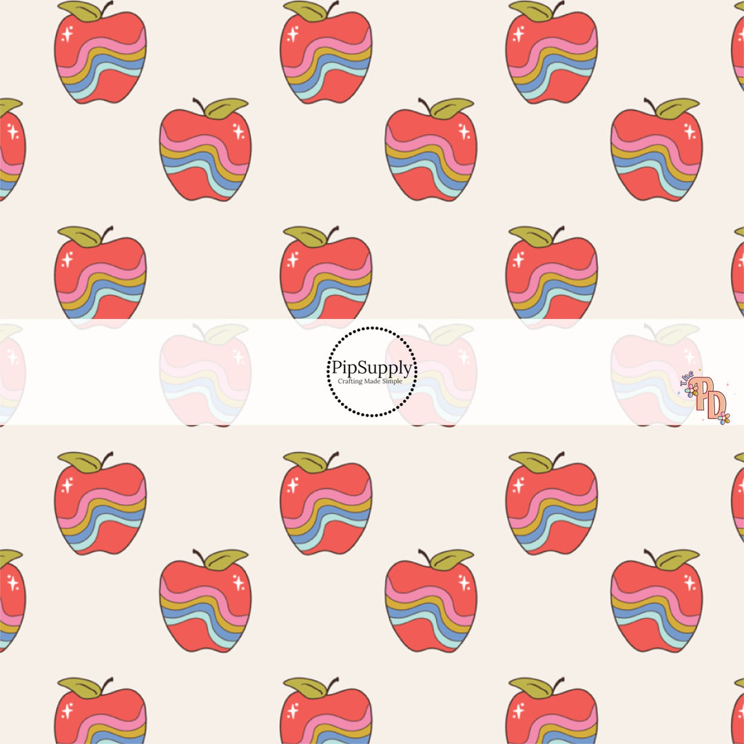 Apples with colorful wavy lines on cream hair bow strips