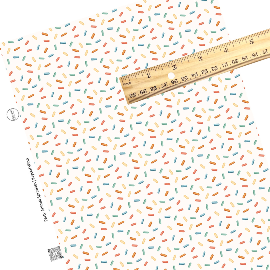 These dessert themed cream faux leather sheets contain the following design elements: colorful sprinkles on cream. Our CPSIA compliant faux leather sheets or rolls can be used for all types of crafting projects.