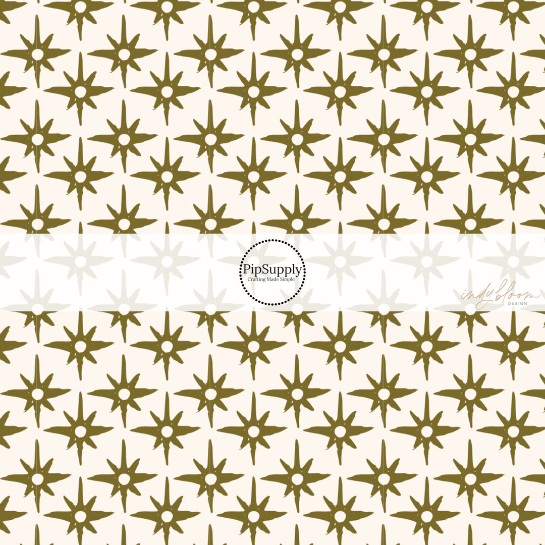 This summer fabric by the yard feature green compass star pattern on cream. This fun summer themed fabric can be used for all your sewing and crafting needs!