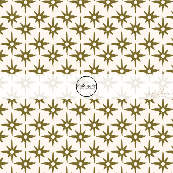 This summer fabric by the yard feature green compass star pattern on cream. This fun summer themed fabric can be used for all your sewing and crafting needs!