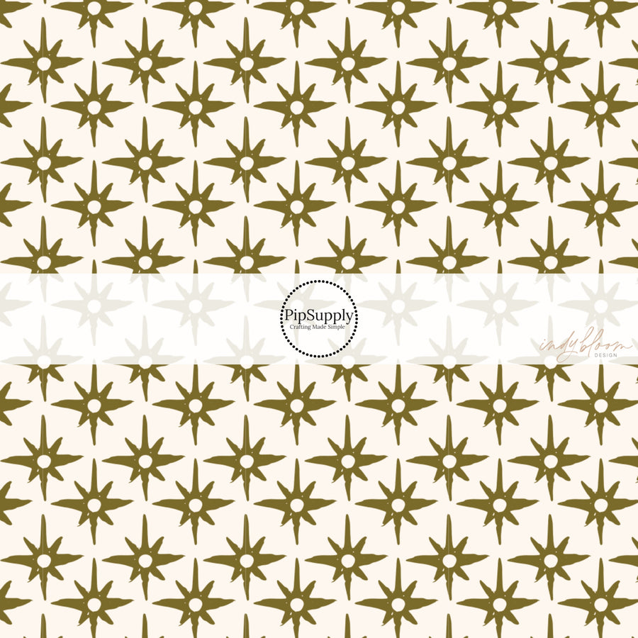 This summer fabric by the yard feature green compass star pattern on cream. This fun summer themed fabric can be used for all your sewing and crafting needs!