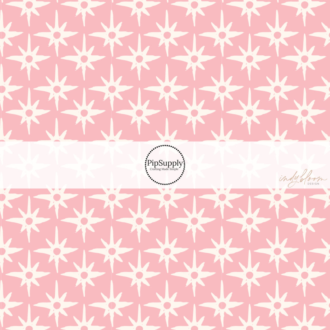 This summer fabric by the yard feature compass star pattern on pink. This fun summer themed fabric can be used for all your sewing and crafting needs!