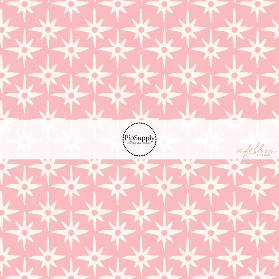 This summer fabric by the yard feature compass star pattern on pink. This fun summer themed fabric can be used for all your sewing and crafting needs!