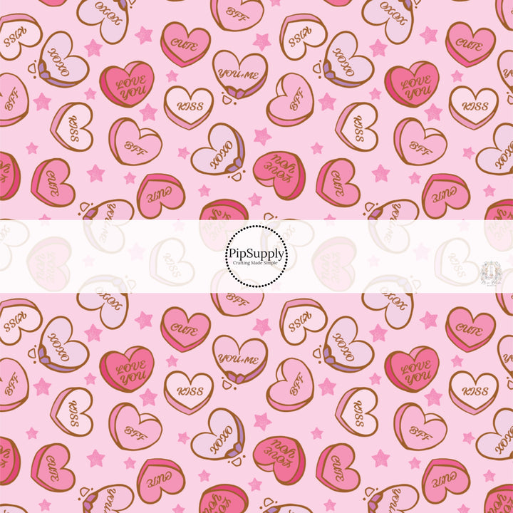 This holiday fabric by the yard features conversation heart candies. This festive pattern fabric can be used for all your sewing and crafting needs!