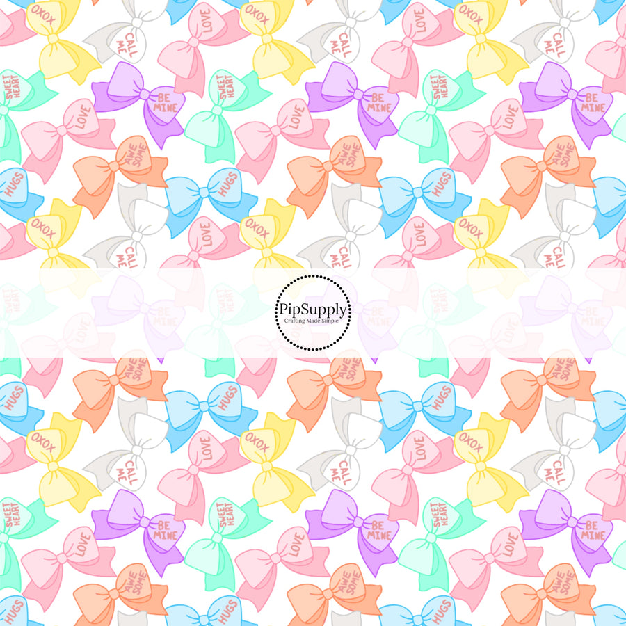 This holiday fabric by the yard features conversation heart bows. This festive pattern fabric can be used for all your sewing and crafting needs!