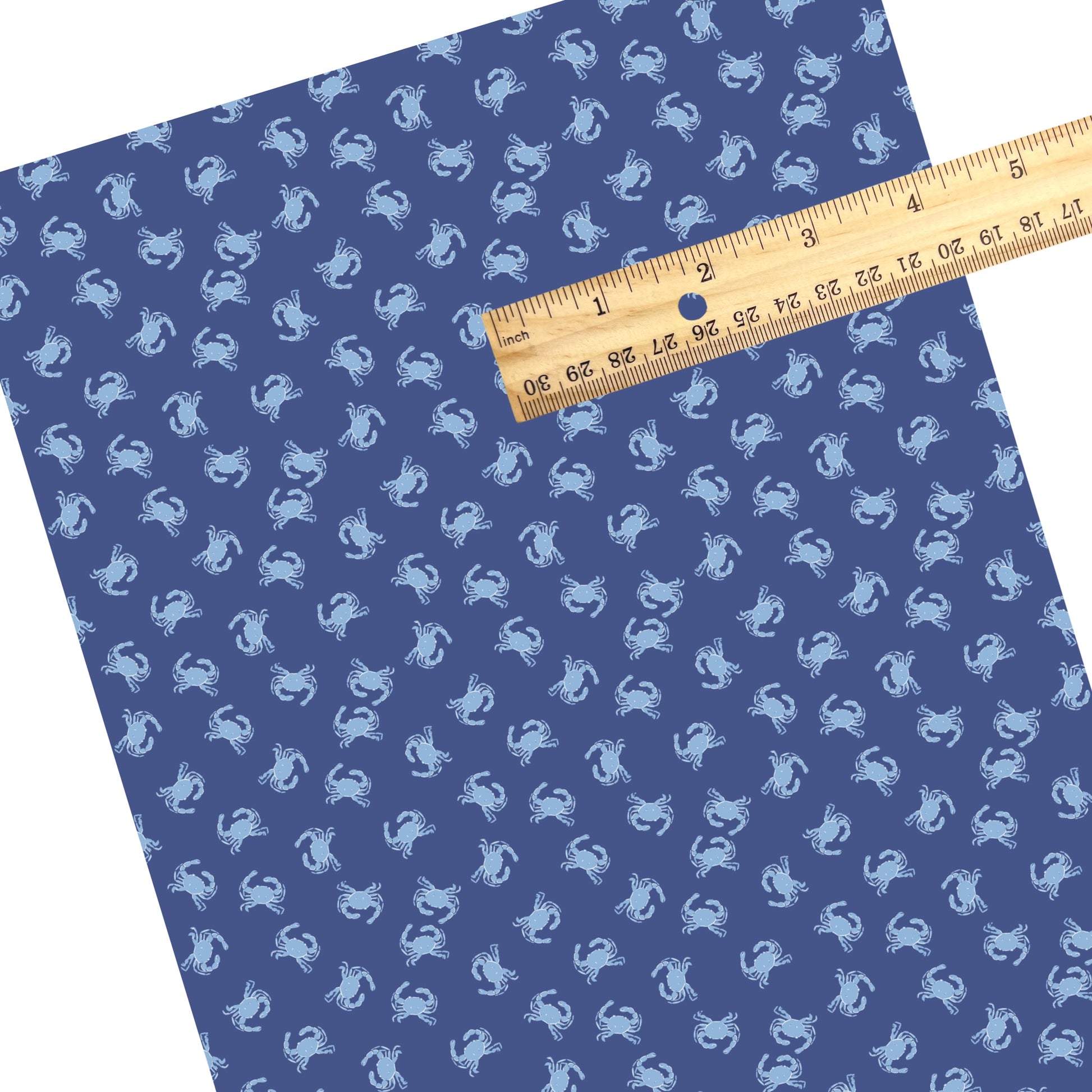 These summer faux leather sheets contain the following design elements: light blue crabs on dark blue. Our CPSIA compliant faux leather sheets or rolls can be used for all types of crafting projects.