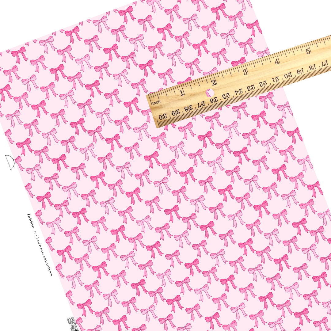 These magical bow themed faux leather sheets contain the following design elements: pink coquette bow pattern. Our CPSIA compliant faux leather sheets or rolls can be used for all types of crafting projects.