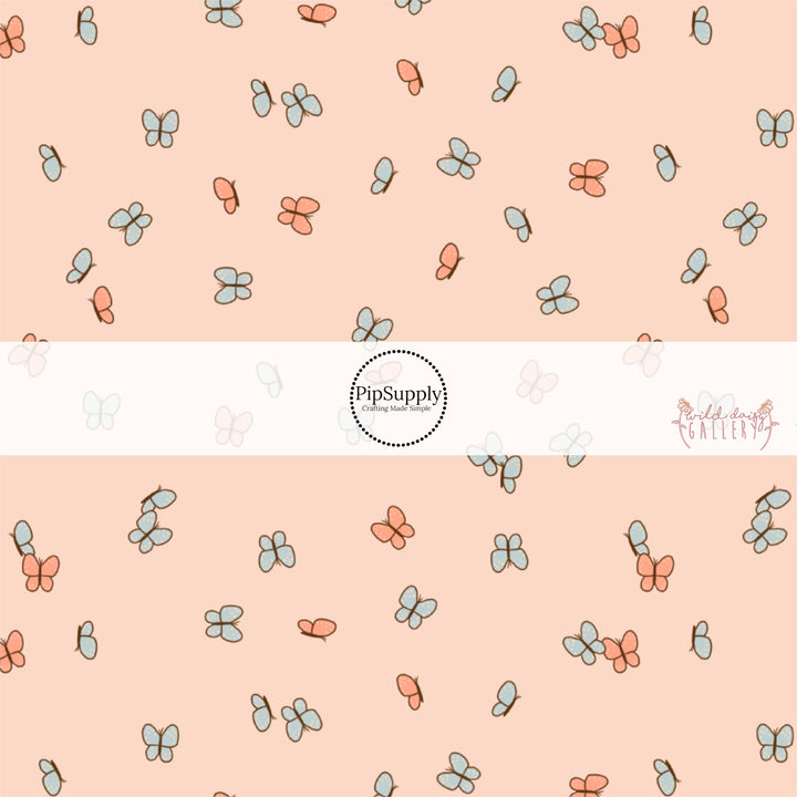 These butterfly themed light cream fabric by the yard features small butterflies in light orange and light blue. 