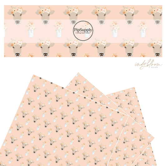 These pastel flowers with cows on blush faux leather sheets contain the following design elements: flower bouquet in jars with cows wearing flower crown.  