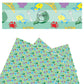 Mermaid tail, crabs, fish, seashells, and fork on green faux leather sheets