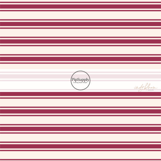 These stripe themed fabric by the yard features mulberry thin and thick stripes on cream. This fun stripe themed fabric can be used for all your sewing and crafting needs! 