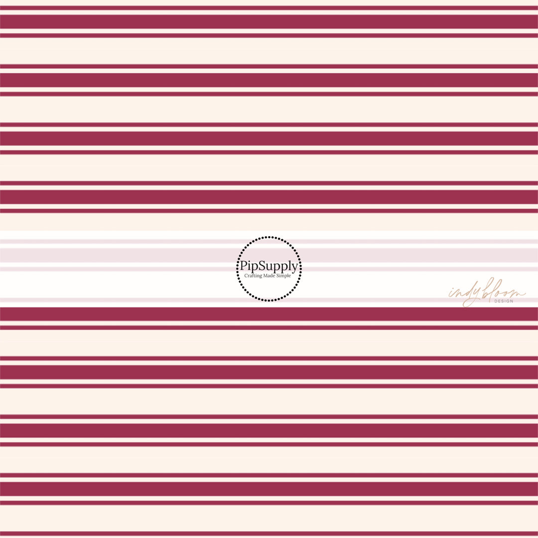 These stripe themed fabric by the yard features mulberry thin and thick stripes on cream. This fun stripe themed fabric can be used for all your sewing and crafting needs! 