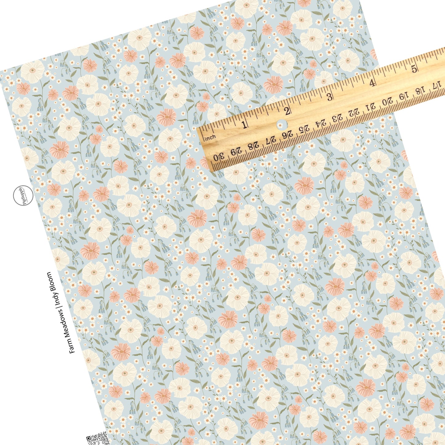 These pastel flowers in a meadow on light blue faux leather sheets contain the following design elements: tan, orange, cream, pink, and blush flowers.