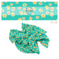 Cream flowers with multi centers and skulls on aqua hair bow strips