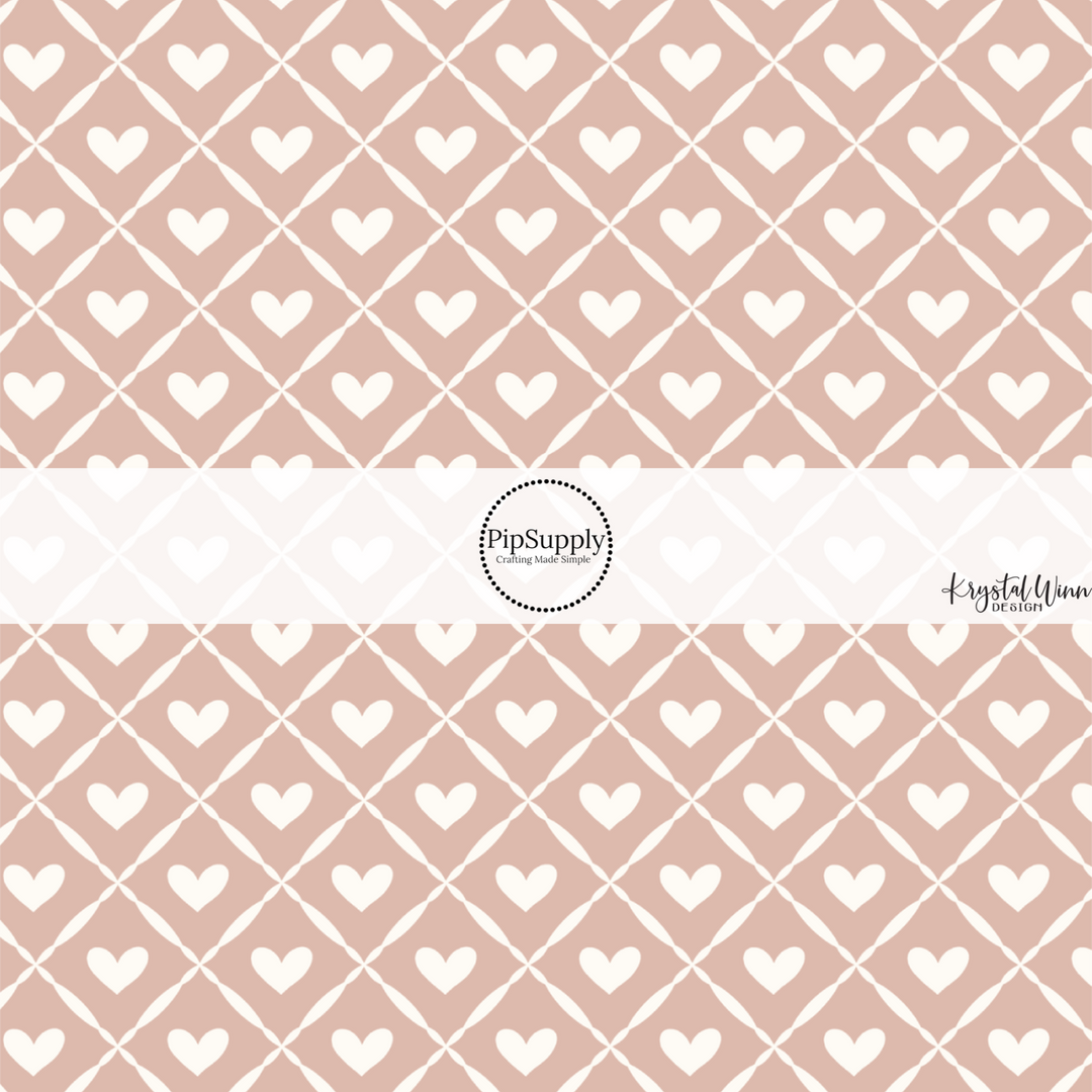 This Valentine's Day themed fabric by the yard features white hearts and white lattice pattern on pink. This fun pattern fabric can be used for all your sewing and crafting needs!