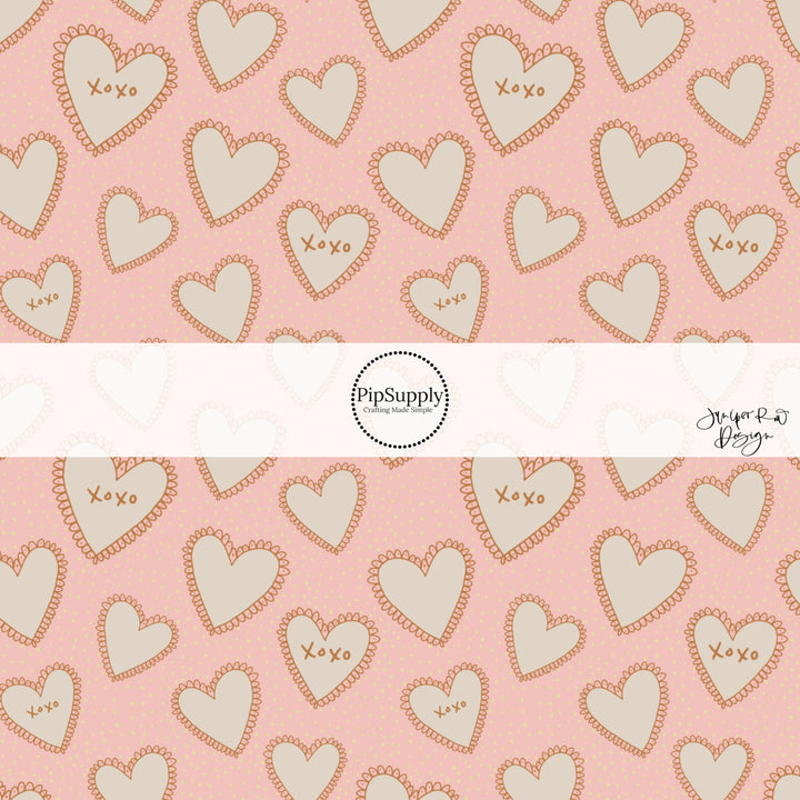 This holiday fabric by the yard features cream lace hearts on pink. This festive pattern fabric can be used for all your sewing and crafting needs!