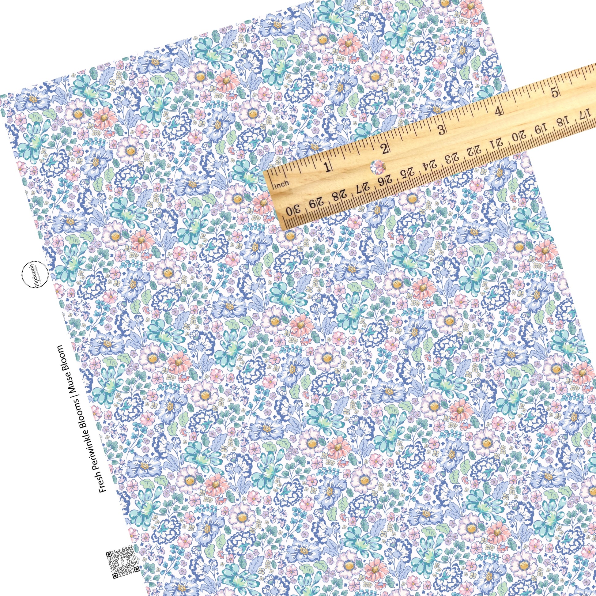 These floral themed cream faux leather sheets contain the following design elements: navy blue, light blue, teal, cream, light pink, yellow, and aqua flowers on cream. 