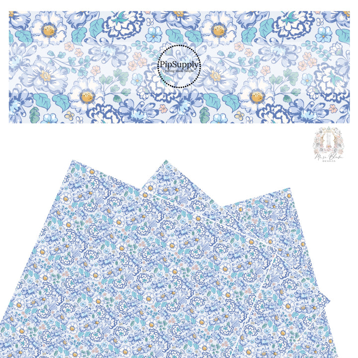 These floral themed blue faux leather sheets contain the following design elements: navy blue, light blue, cream, yellow, and aqua flowers on periwinkle. 