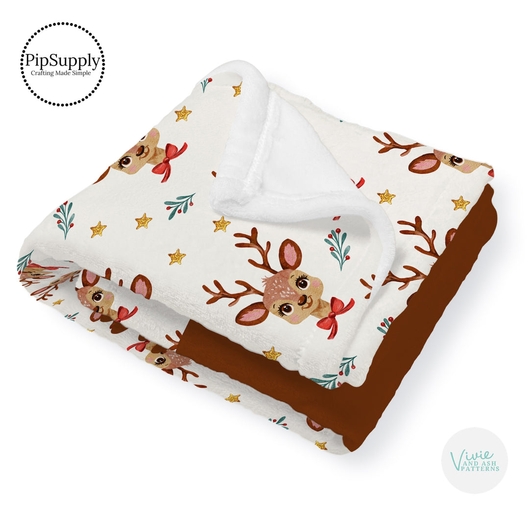 This winter designer pattern is printed onto the front side of our soft touch minky blankets. The backside will not be printed and left the natural cream/white color of the blanket. This print pattern features Christmas reindeer on cream.