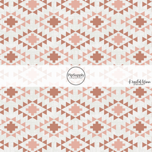 These small western patterns on cream fabric by the yard features blush and rust colored western aztec pattern.