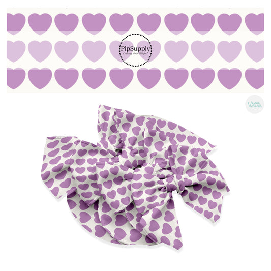 Lines of purple hearts on cream hair bow strips