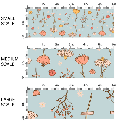 This scale chart with small scale, medium scale, and large scale of these wildflower themed light blue fabric by the yard features white, cream, yellow, and orange flowers.