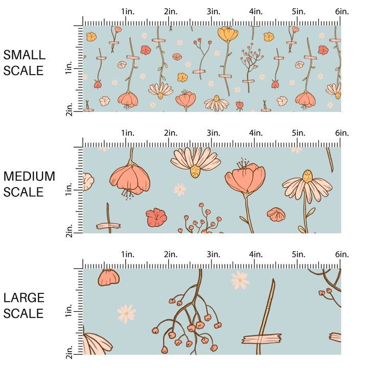 This scale chart with small scale, medium scale, and large scale of these wildflower themed light blue fabric by the yard features white, cream, yellow, and orange flowers.