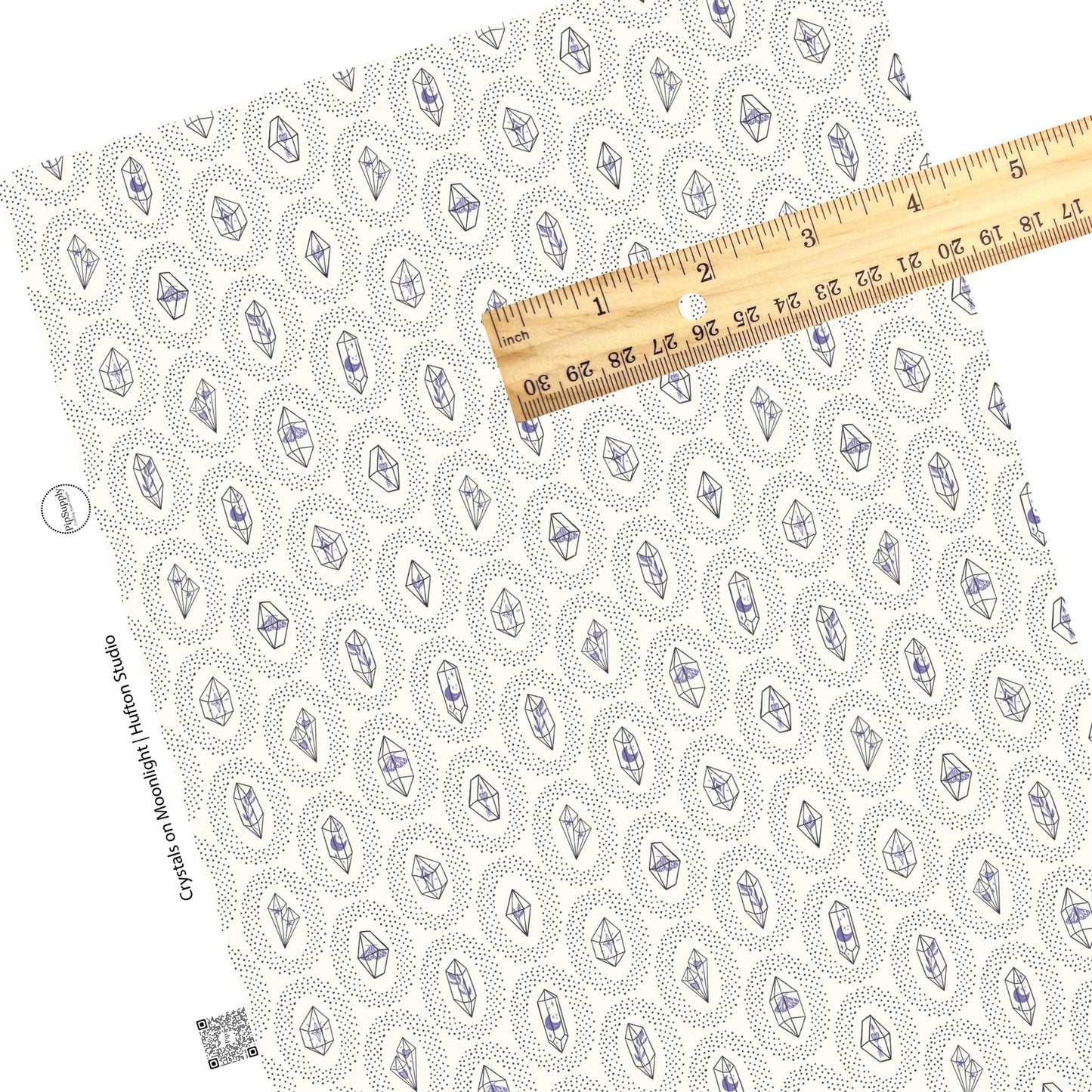 These crystal dot themed light cream faux leather sheets contain the following design elements: small black dots surrounding crystals on ivory.  Our CPSIA compliant faux leather sheets or rolls can be used for all types of crafting projects. There are periwinkle flowers, butterflies, and charms inside each crystal. 