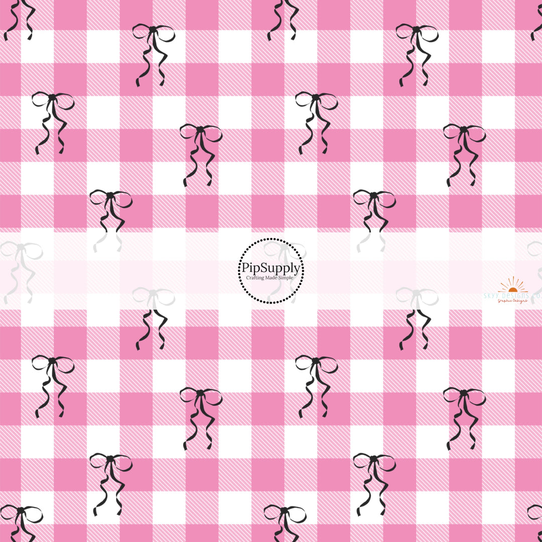 This holiday fabric by the yard features pink gingham and black bows. This festive pattern fabric can be used for all your sewing and crafting needs!