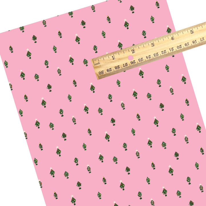 These Christmas themed pattern faux leather sheets contain the following design elements: tiny Christmas trees on pink. Our CPSIA compliant faux leather sheets or rolls can be used for all types of crafting projects.