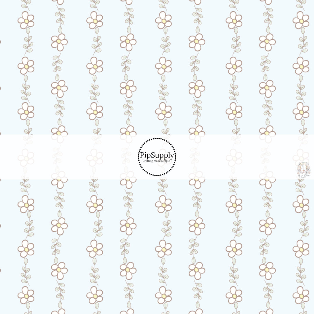 This spring floral fabric by the yard features tiny daisies on light blue. This seasonal pattern fabric can be used for all your sewing and crafting needs!