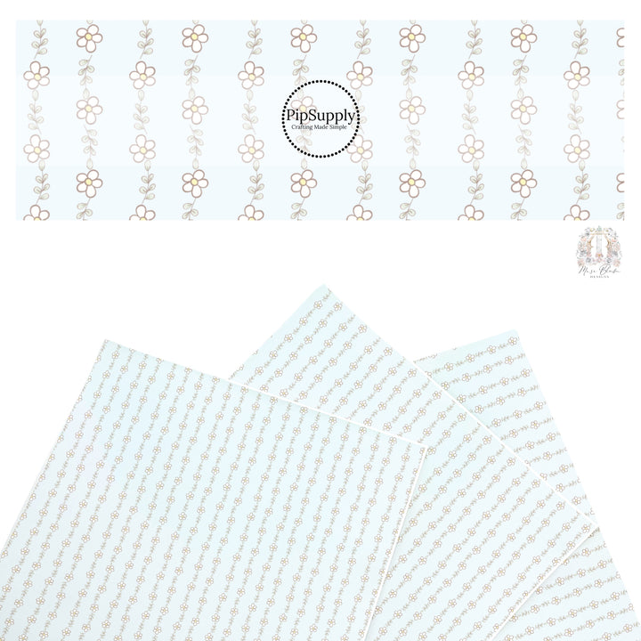 These spring floral faux leather sheets contain the following design elements: tiny daisies on light blue. Our CPSIA compliant faux leather sheets or rolls can be used for all types of crafting projects.