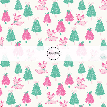 These Christmas themed pattern fabric by the yard features the following design elements: pink and green Christmas trees and deer. This fun themed fabric can be used for all your sewing and crafting needs!