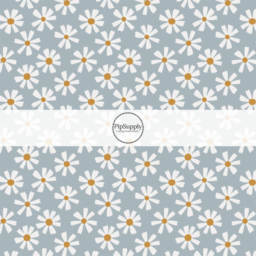 This summer fabric by the yard features white daisies on blue. This fun summer themed fabric can be used for all your sewing and crafting needs!