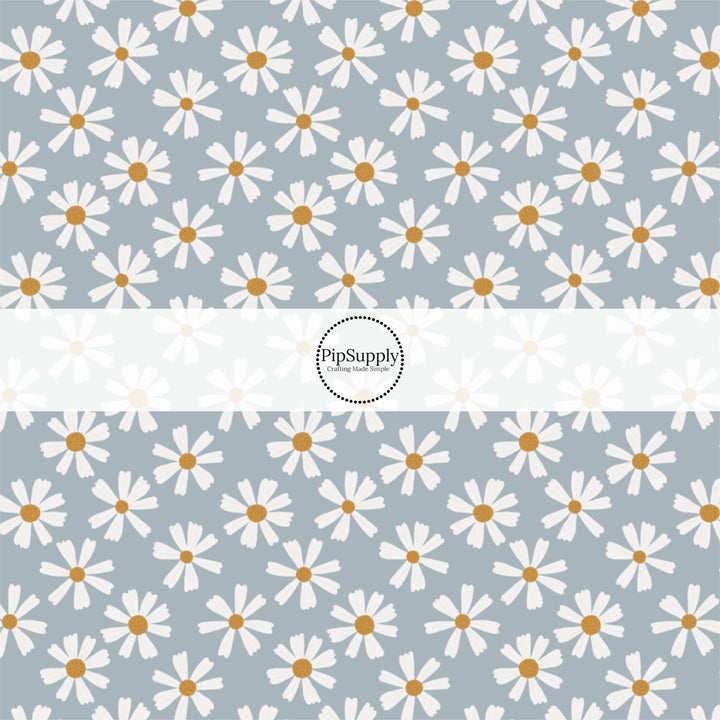 This summer fabric by the yard features white daisies on blue. This fun summer themed fabric can be used for all your sewing and crafting needs!