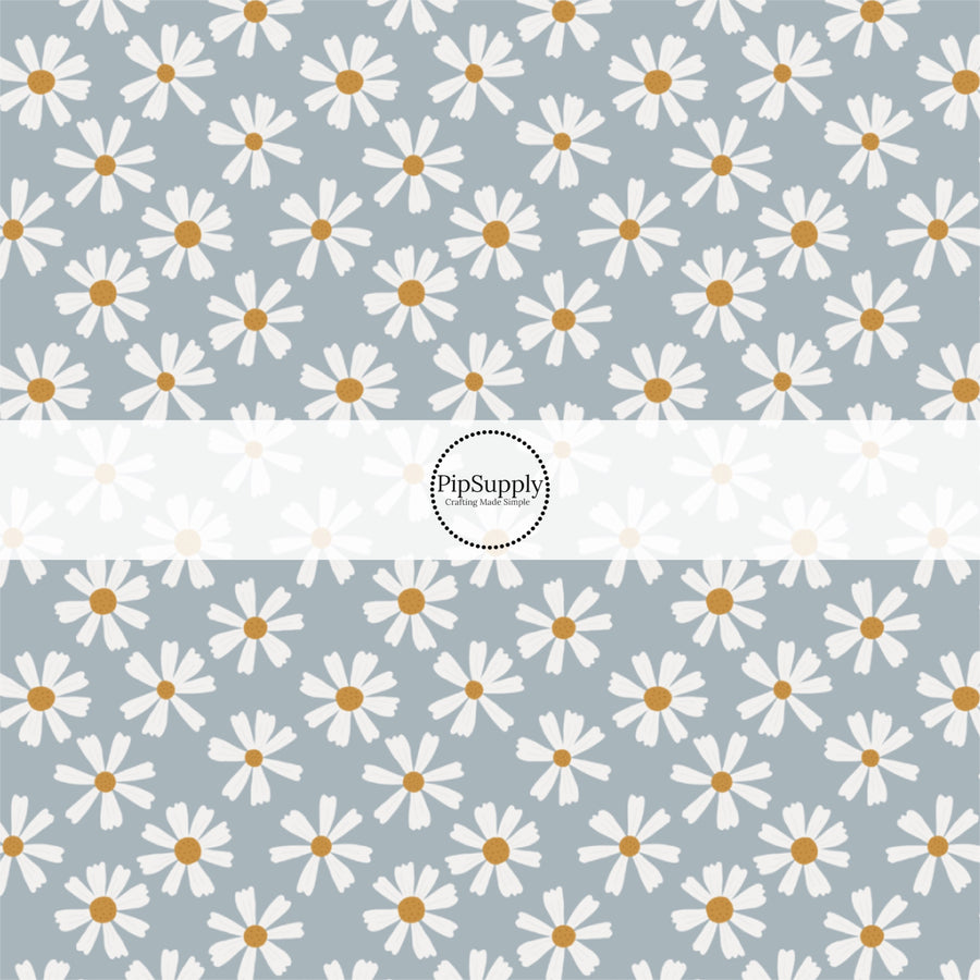 This summer fabric by the yard features white daisies on blue. This fun summer themed fabric can be used for all your sewing and crafting needs!