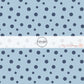 These dot themed light blue fabric by the yard features small dark navy blue dots on light blue. 