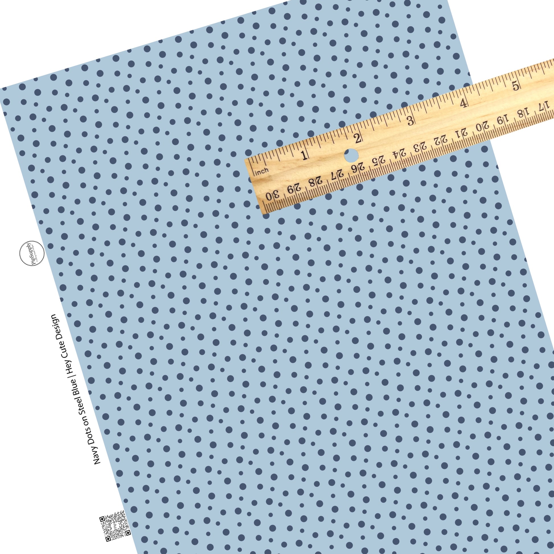 These dot themed light blue faux leather sheets contain the following design elements: small dark blue dots on light blue.